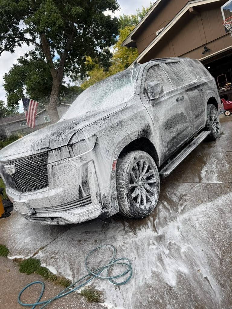 Cadillac Escalade covered in foam during the wash